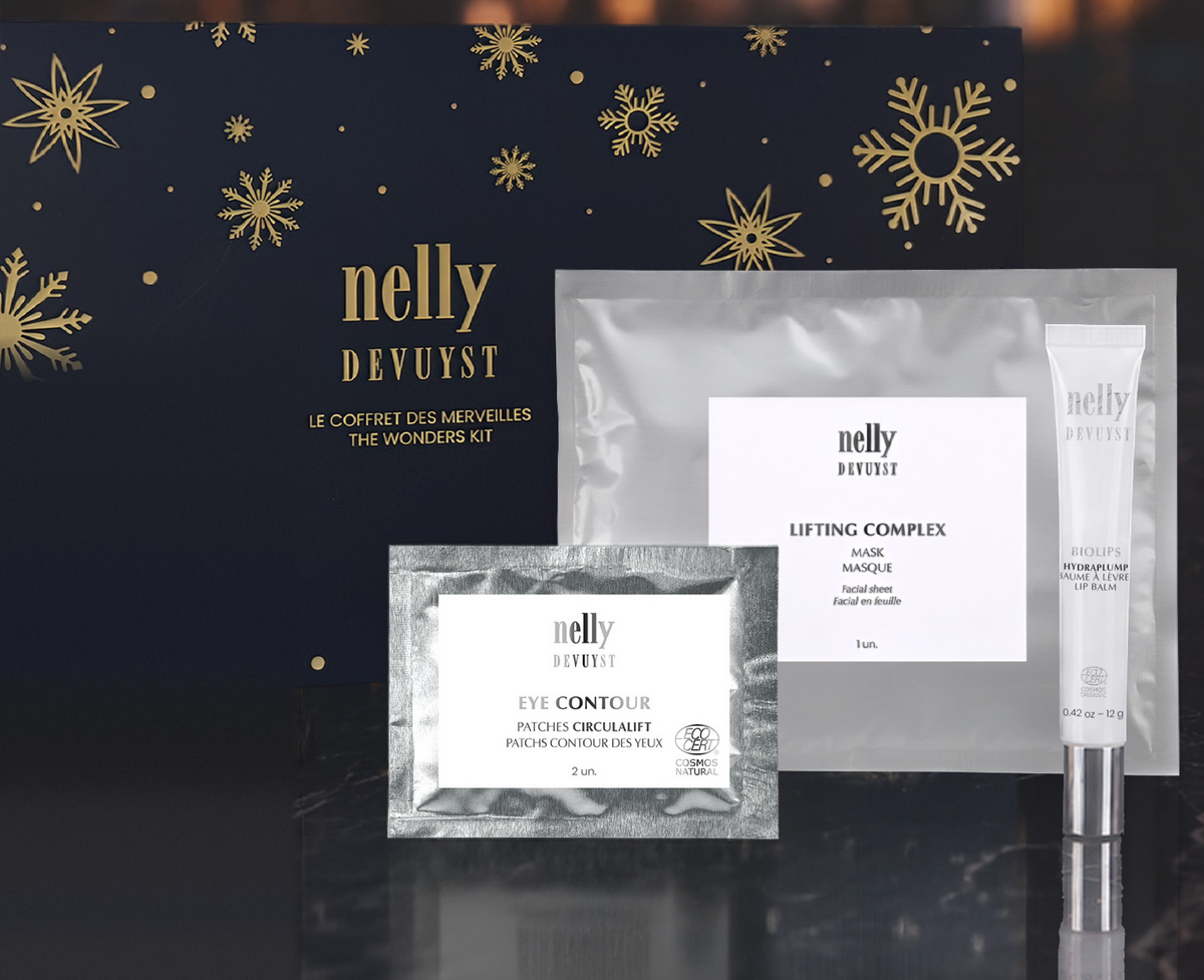 Coffret des fêtes Trio des Merveilles Nelly Devuyst contenant le masque Lifting Complex en feuille, les patches contour des yeux CirculaLift et le baume à lèvres BioLips HydraPlump, dans son emballage cadeau noir et or.