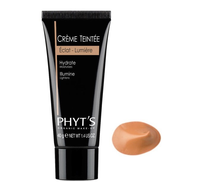 Crème teintée Éclat Lumière Phyt’s en tube noir avec texture beige dorée pour illuminer et hydrater naturellement les teints clairs à moyens.
