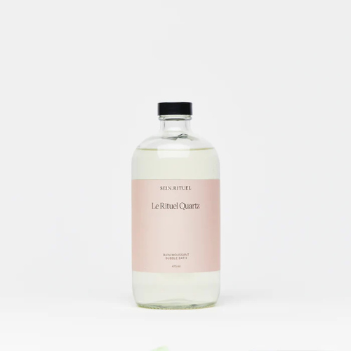 Bouteille de bain moussant Rituel Quartz, formule delicate aux extraits botaniques, offrant une mousse abondante pour un rituel de bain relaxant et regenerant.