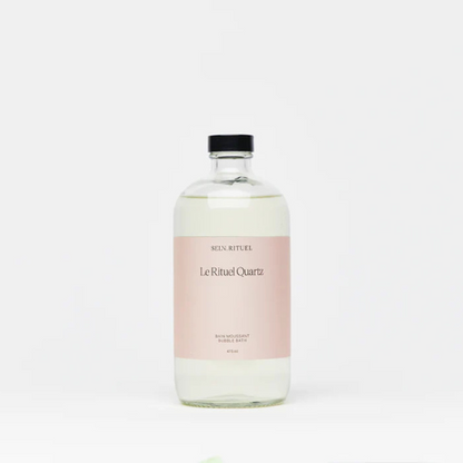 Bouteille de bain moussant Rituel Quartz, formule delicate aux extraits botaniques, offrant une mousse abondante pour un rituel de bain relaxant et regenerant.